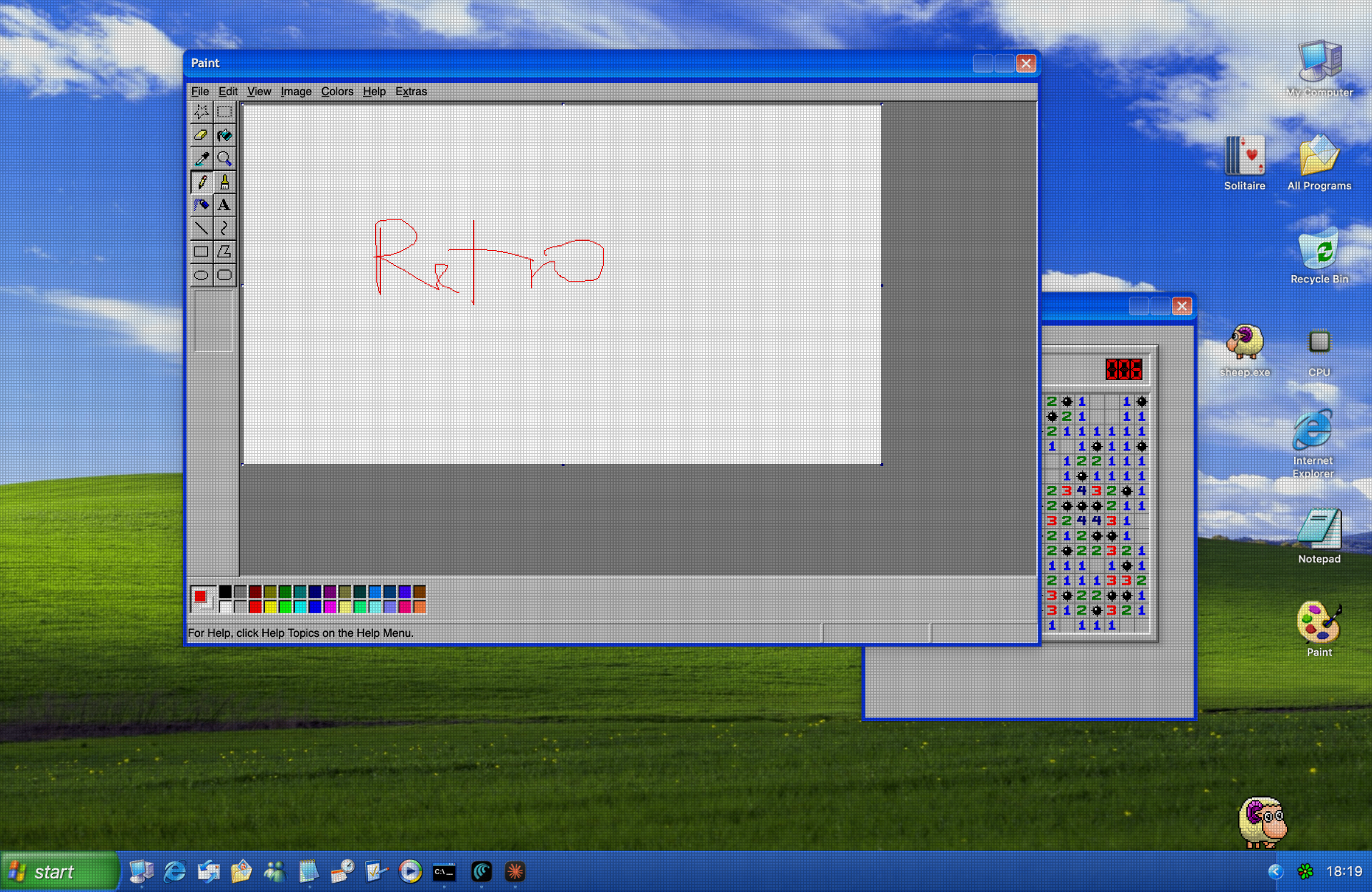 Windows XP Luna desktop theme on macOS with Bliss wallpaper, green Start button and taskbar
